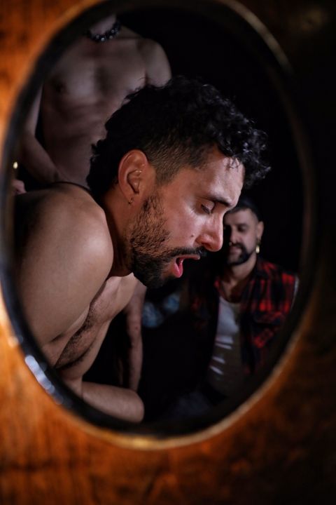 Creator at a leather bar mirror